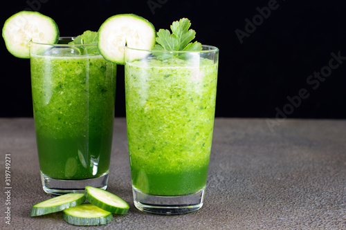 Glass of fresh cucumber juice. Green smoothie. Detox water. Healthy drink.