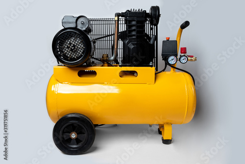 Air compressor on gray background photo
