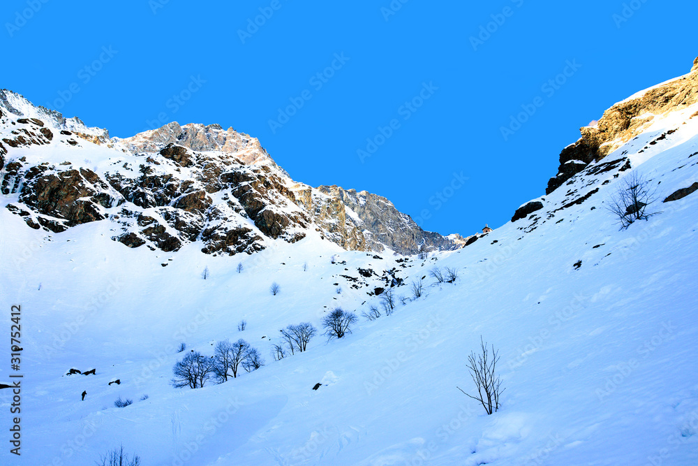 View of the high section of the Po valley, full of snow, just down the Monviso mount, in a sunny winter morning