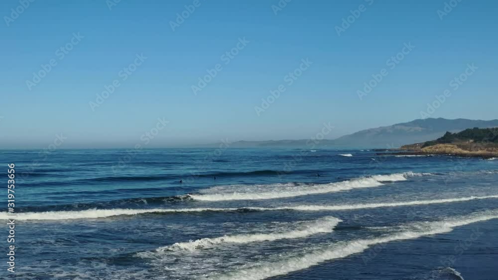 Surfers on a waves in ocean Surfers on a waves in ocean