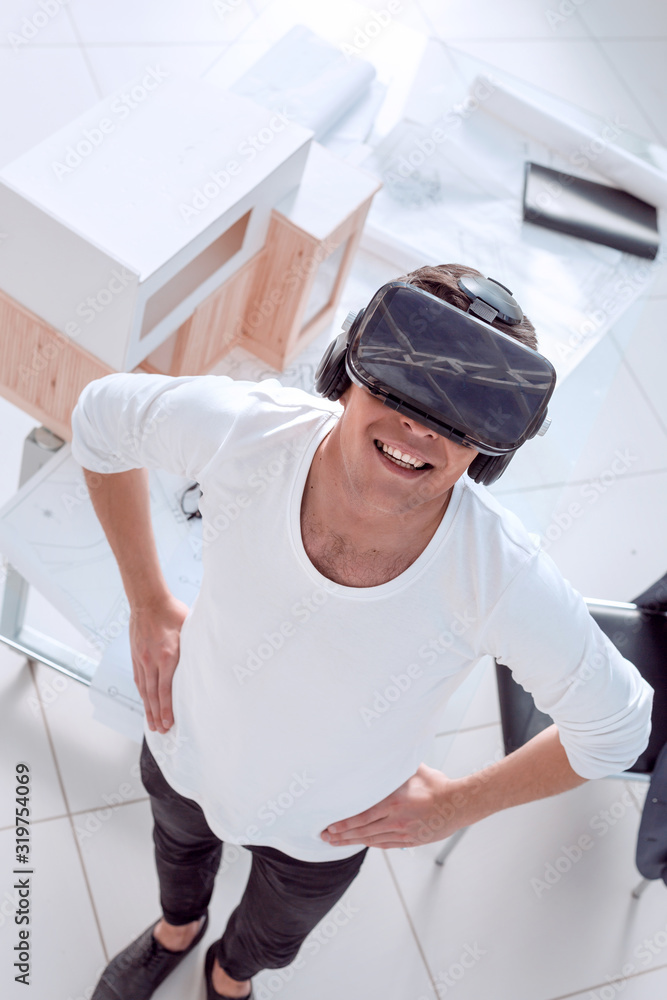 architect in a virtual reality helmet in the creative Studio