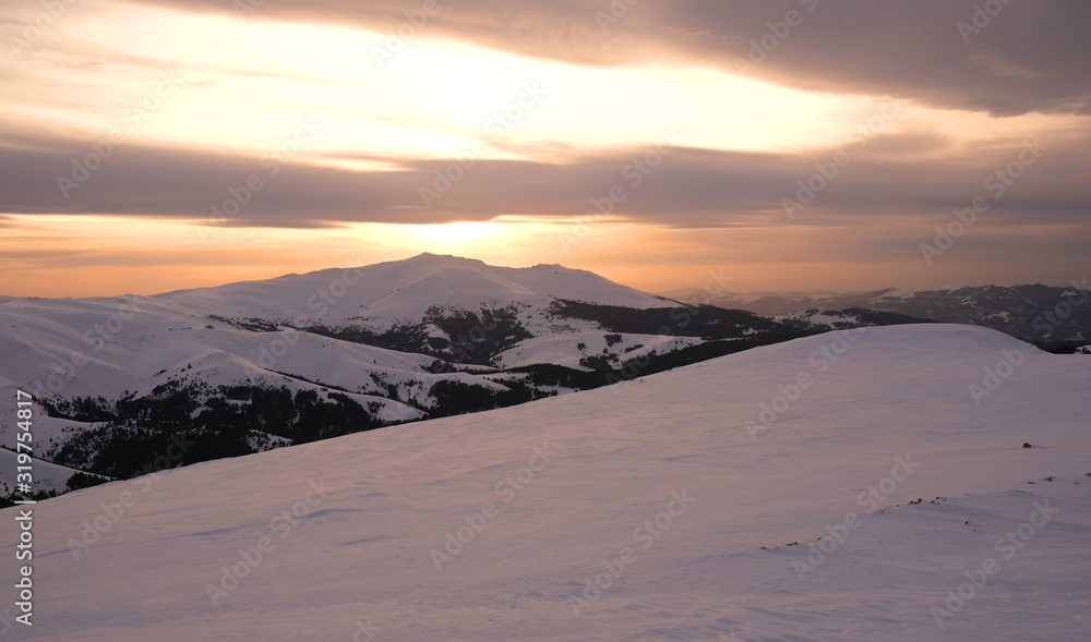 Sunset in Snowy Mountains