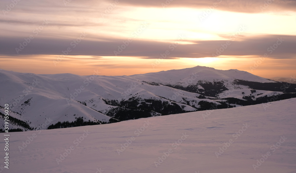 Sunset in Snowy Mountains