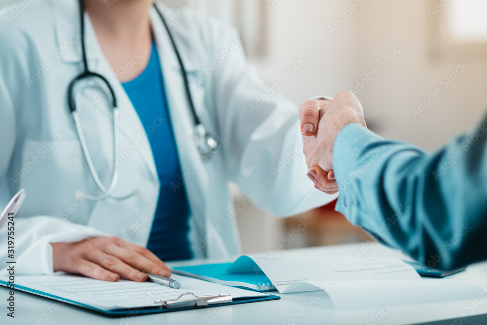 Detail of Doctor and Patient Handshake Detail of Doctor and Patient Handshake