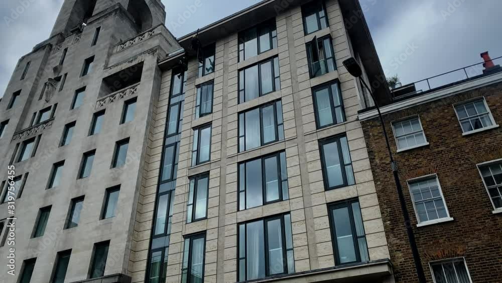 Industrial cleaners clean windows on a high building Industrial cleaners clean windows on a high building