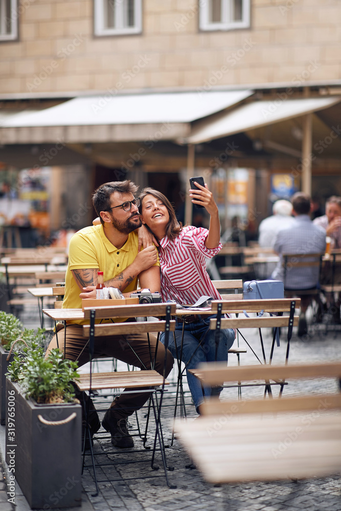 Loving couple in a vacation trip making selfie. Loving couple in a vacation trip making selfie.