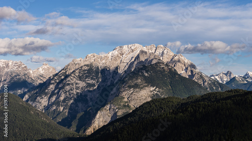 Mountain range with forest in Italian Dolomites.