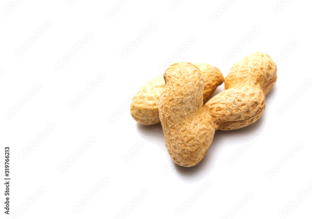 Peanut in a shell isolated on white background. Dried peanuts in closeup. Peanut in a shell isolated on white background. Dried peanuts in closeup.
