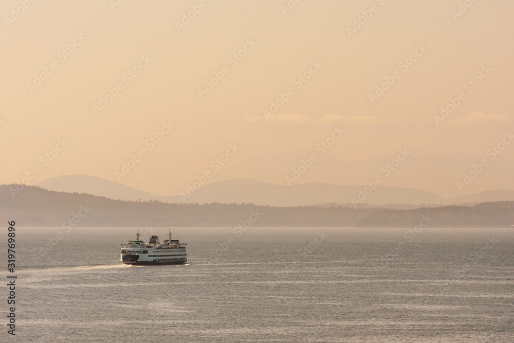 Ferry boat carrying passengers and cars across Puget Sound from Seattle towards Olympic peninsula, Washington, USA