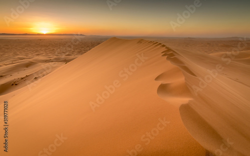 Sunset over sand dunes of Sahara  Merzouga  Morocco