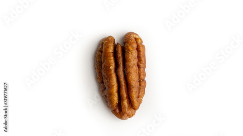 One pecan nut isolated. White background