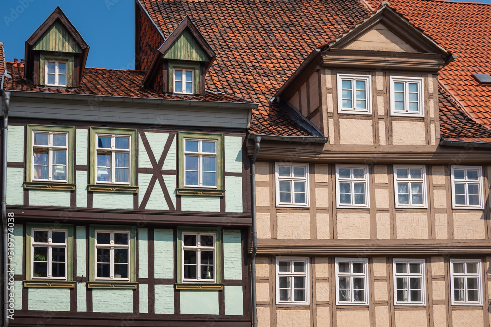 Front view of the facade of a traditional  half-timbered house. An example of Fachwerk in the medieval city of Quedlinburg, Saxony-Anhalt, Germany. 