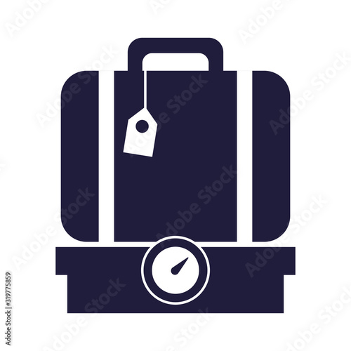 suitcase travel baggage in scale balance