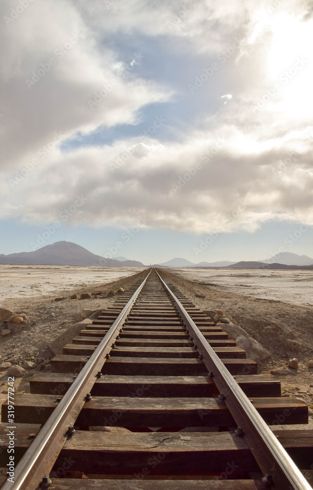 shut down rail tracks leading to the horizon in Salar de Uyuni, Bolivia shut down rail tracks leading to the horizon in Salar de Uyuni, Bolivia