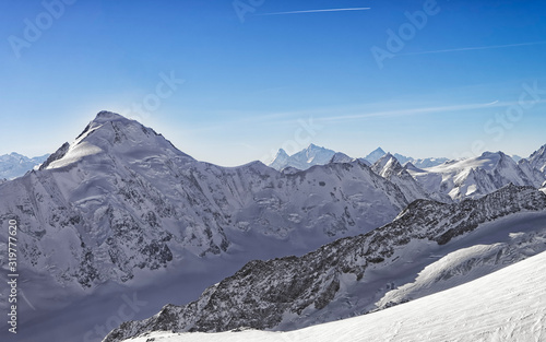 Swiss alpine peaks landscape panorama of Bern Highland with Matterhorn at horizon helicopter view