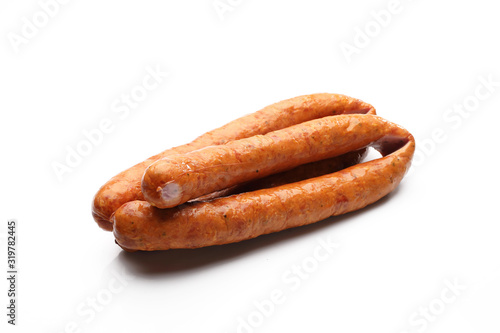 Rings of smoked pork sausage isolated on a white background.