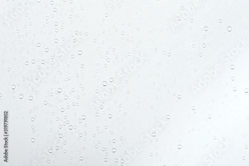Water drops on white surface background.