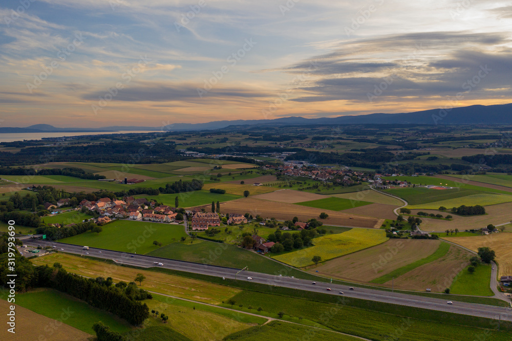 aerial drone footage, landscape, clouds, sunset, fields