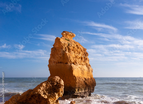Beautiful rocky beach praia da marinha near Carvoeiro at the coast of Algarve, Portugal. Wonderful landscape and seascape for tourism and travel and nature topics