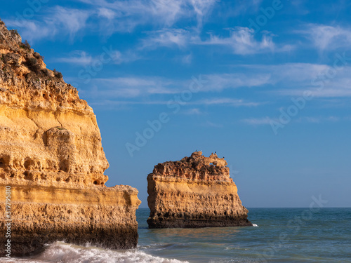 Beautiful rocky beach praia da marinha near Carvoeiro at the coast of Algarve, Portugal. Wonderful landscape and seascape for tourism and travel and nature topics