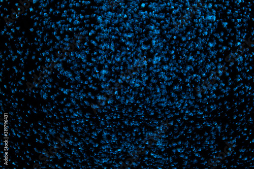 Background blue shallow bokeh as beads, texture, sparkles