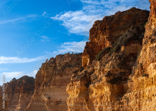 Beautiful rocky beach praia da marinha near Carvoeiro at the coast of Algarve, Portugal. Wonderful landscape and seascape for tourism and travel and nature topics