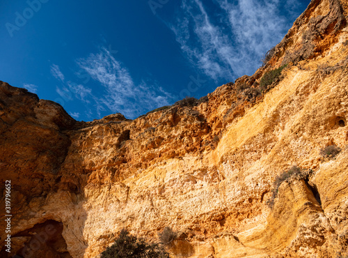 Beautiful rocky beach praia da marinha near Carvoeiro at the coast of Algarve, Portugal. Wonderful landscape and seascape for tourism and travel and nature topics