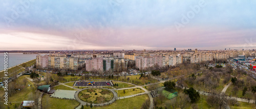 Aerial panorama of a beautiful sunset view in Crangasi above the Crangasi Park, Bucharest, Romania..