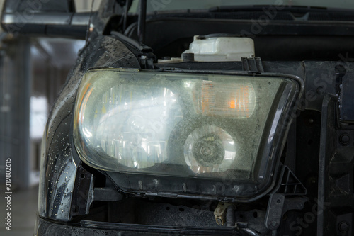 Hazy and foggy car headlight before celaning.