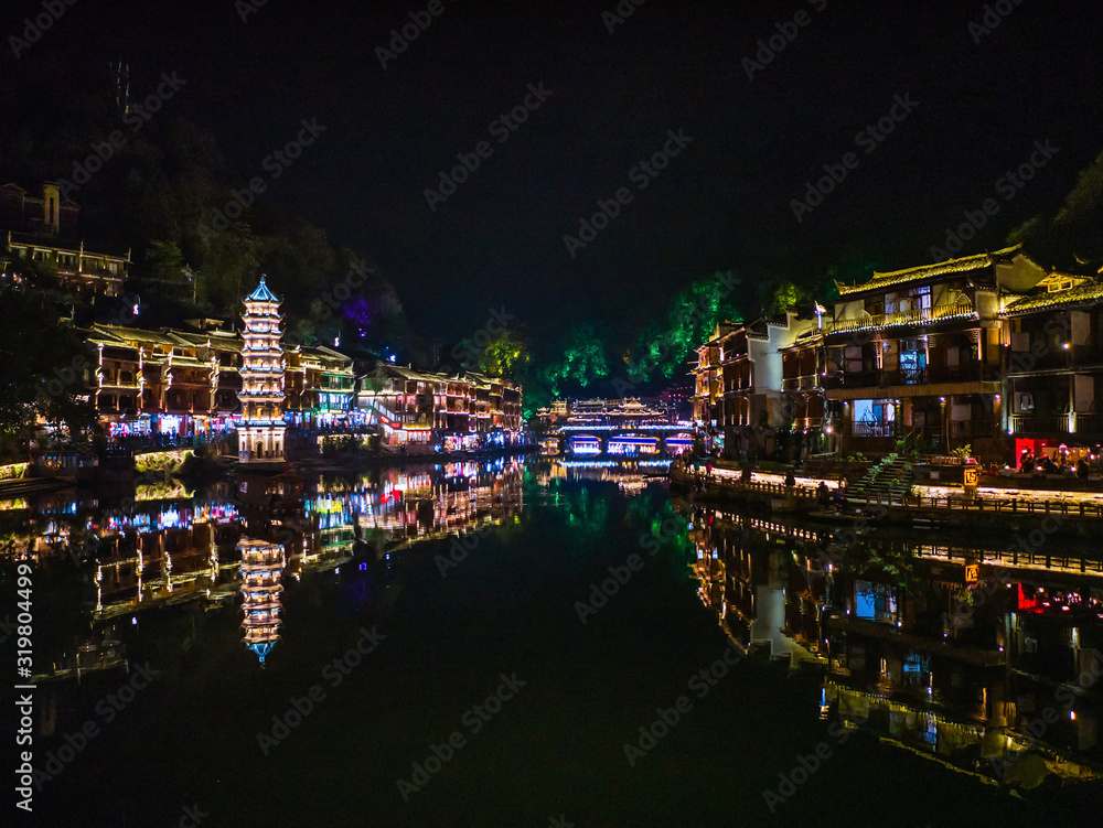 Naklejka premium Scenery view in the night of fenghuang old town .phoenix ancient town or Fenghuang County is a county of Hunan Province, China