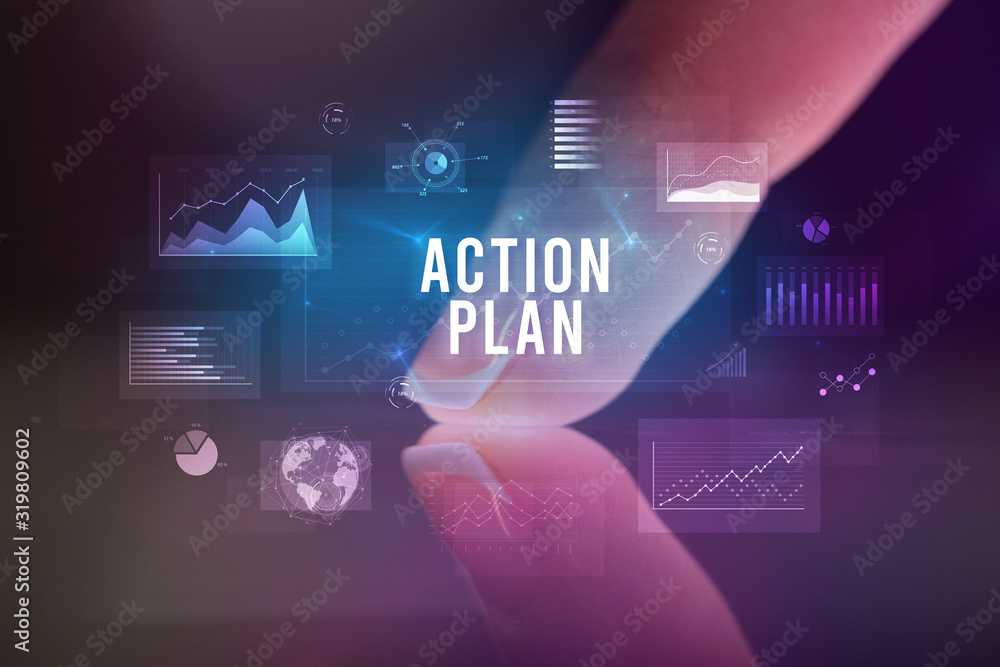 Finger touching tablet with charts and ACTION PLAN inscription, business concept Finger touching tablet with charts and ACTION PLAN inscription, business concept
