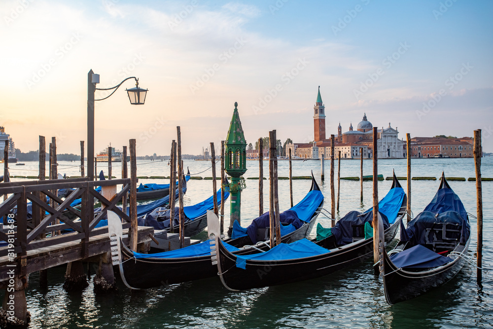 Gondolas of Venice Italy in the morning against the backdrop of sunrise