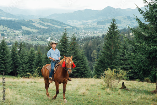 Cowboys on horseback.Cowboys riding horse in mountains.