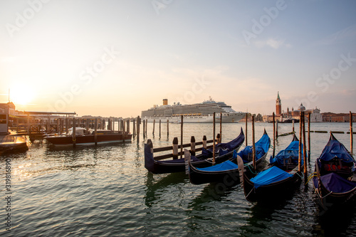 Gondolas of Venice Italy in the morning against the backdrop of sunrise © Sergei Malkov