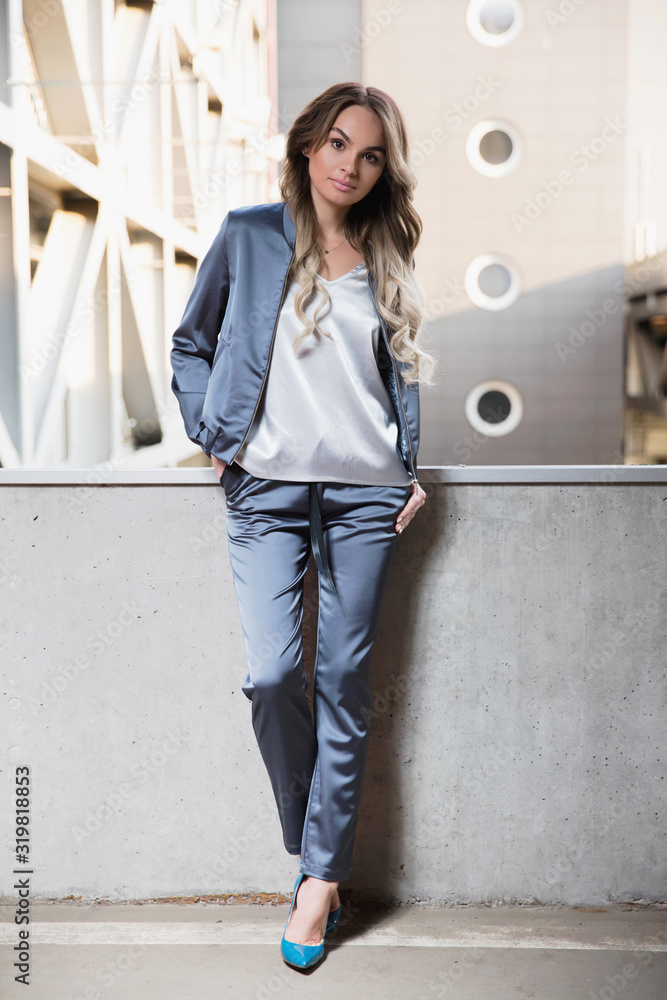 Young attractive woman posing outdoors