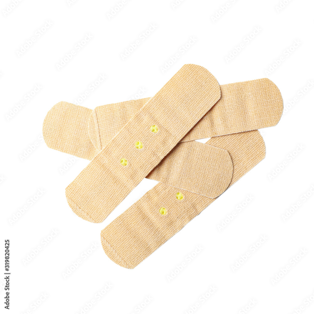 Medical sticking plasters isolated on white. First aid item Medical sticking plasters isolated on white. First aid item