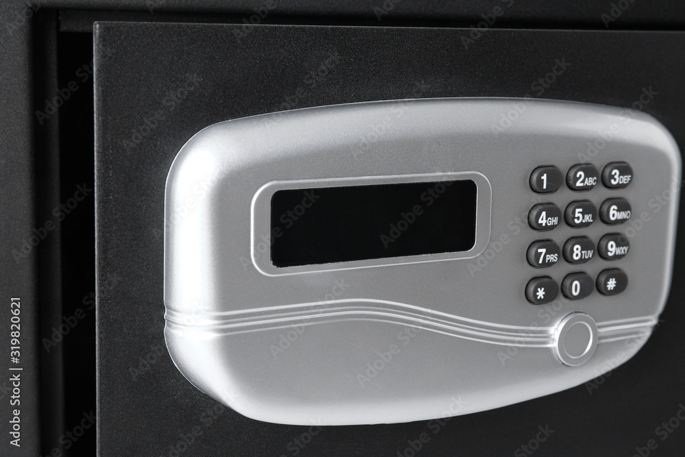 Open black steel safe with electronic lock, closeup Open black steel safe with electronic lock, closeup