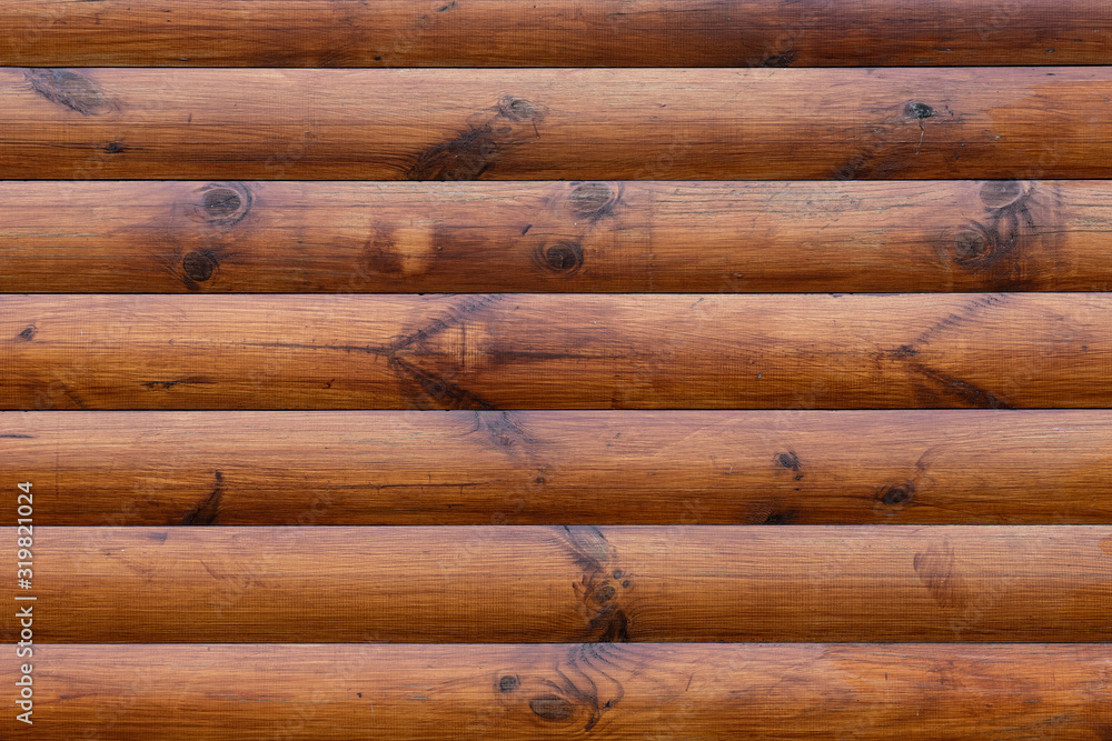 Background of horizontal wooden bars of bright brown color Background of horizontal wooden bars of bright brown color
