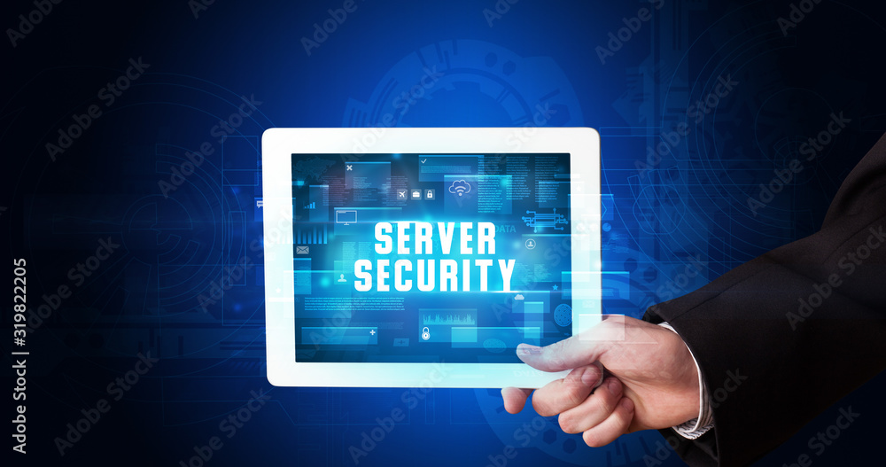 Young business person working on tablet and shows the digital sign: SERVER SECURITY Young business person working on tablet and shows the digital sign: SERVER SECURITY