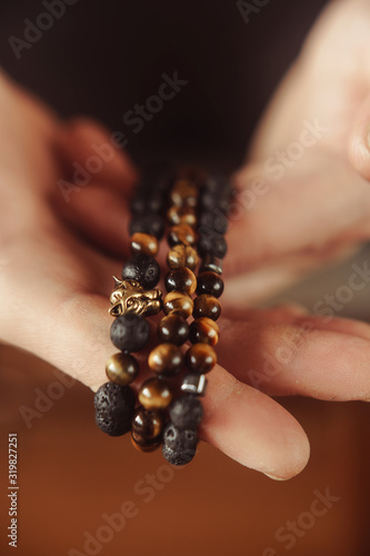 close-up bracelets on a guy’s hand