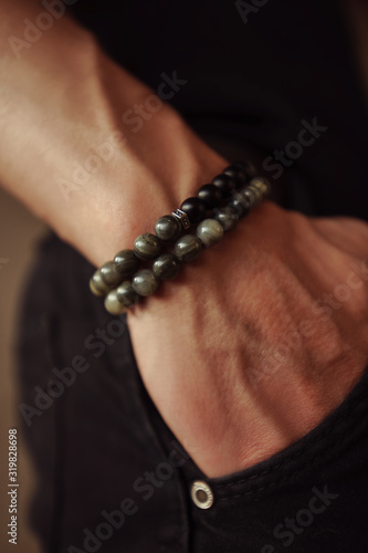 close-up bracelet on a guy’s hand