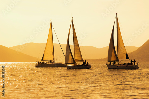 Sailing boats on water, regatta. Montenegro, Adriatic Sea, view of Bay of Kotor. Color toning