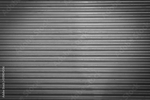 Metal texture pattern, ribbed cast iron surface, textured black background , wall for dark backdrop , loft style interior.