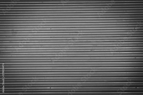 Metal texture pattern, ribbed cast iron surface, textured black background , wall for dark backdrop , loft style interior.