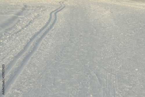 Ski track in snow   active winter holiday concept.