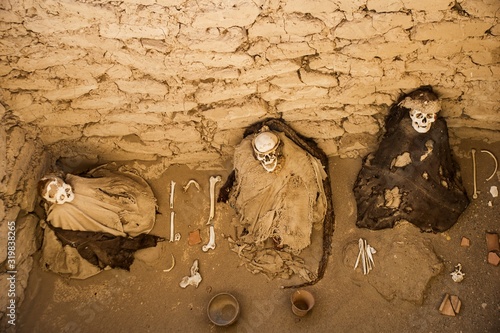 Mummies in the Chauchilla Cemetery in desert near Nazca and Ica in Peru.
