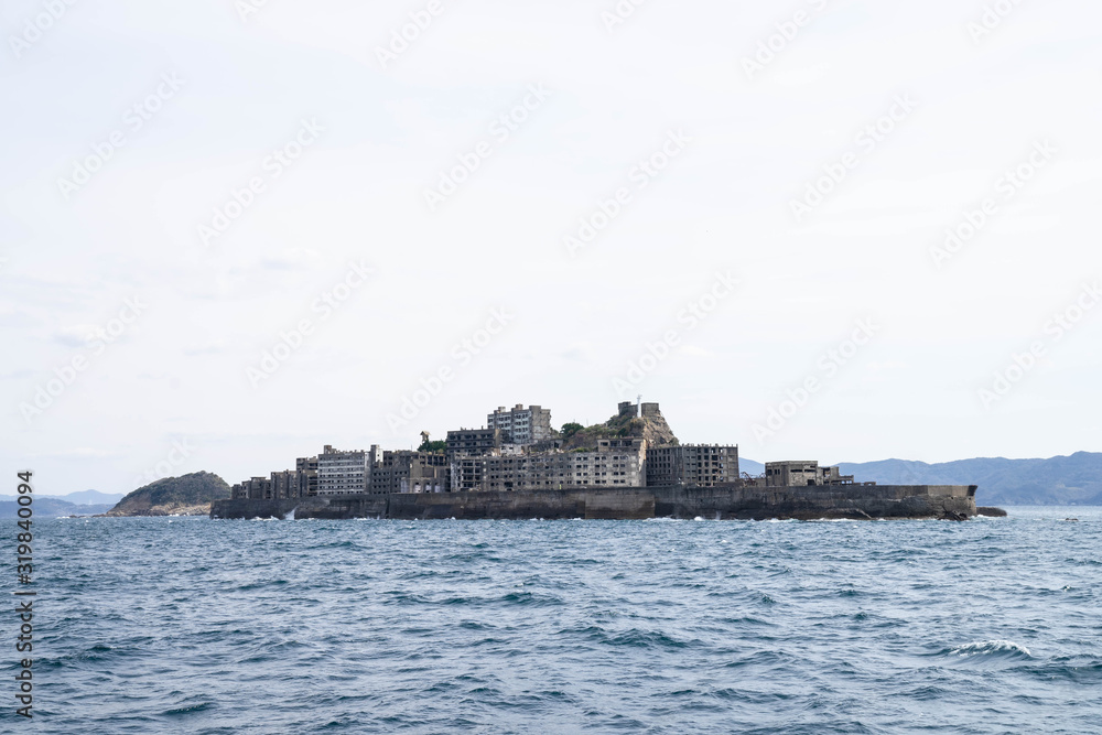 Hashima Island in Nagasaki, Japan. A symbol of the rapid industrialization of Japan. It is a UNESCO World Heritage site. Hashima Island in Nagasaki, Japan. A symbol of the rapid industrialization of Japan. It is a UNESCO World Heritage site.