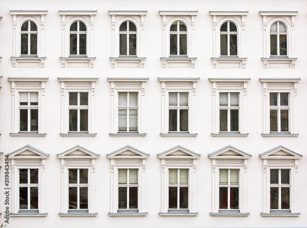 Rows of windows on white facade of the building, architectural background