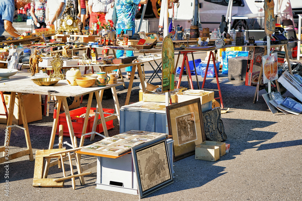 Ascona, Switzerland - August 23, 2016: Various goods for selling at the counter in the flea street market in Ascona, Lake Maggiore, Ticino canton, Switzerland.