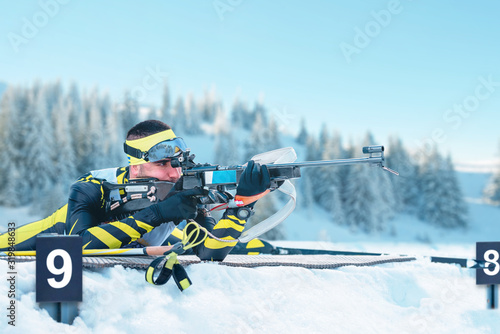 Cuadro en lienzo Biathlete shoots targets with a rifle